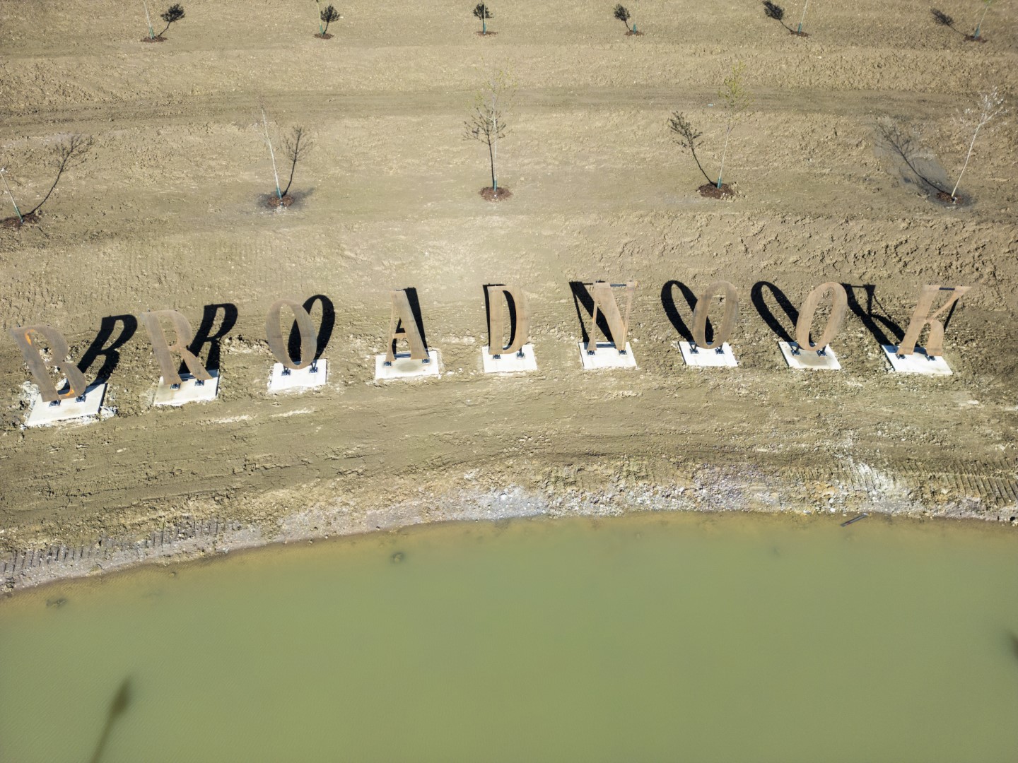 The Broadnook lettering is made of corten steel that will rust to a beautiful burnt orange with time and exposure to the elements.